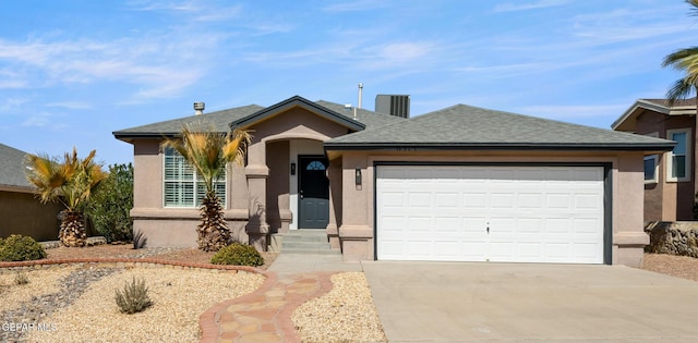 ranch-style house with a garage, concrete driveway, roof with shingles, and stucco siding