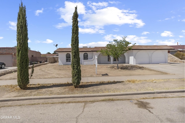 view of front of property featuring driveway and an attached garage