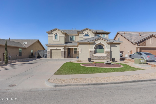 12345 Stansbury Dr, El Paso, TX 79928 - view of front of home with concrete driveway, stone siding, a tile roof, an attached garage, and stucco siding
