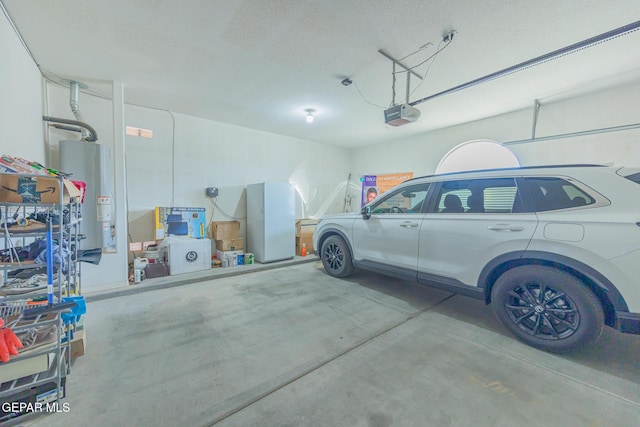 garage with water heater and a garage door opener