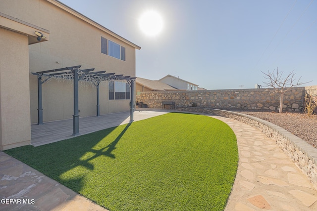 view of yard featuring a patio area, a fenced backyard, and a pergola