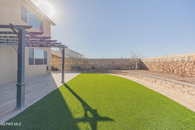 view of yard with a patio area, a fenced backyard, and a pergola