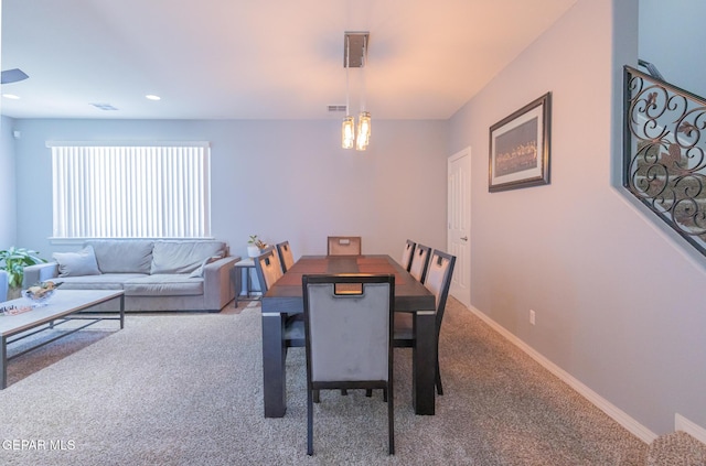 carpeted dining room featuring recessed lighting, visible vents, and baseboards