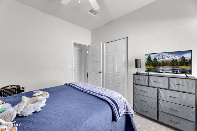 carpeted bedroom with ceiling fan, visible vents, and a closet