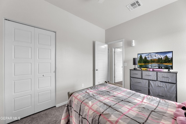 bedroom featuring baseboards, a closet, visible vents, and carpet flooring