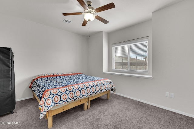 bedroom featuring ceiling fan, carpet floors, visible vents, and baseboards