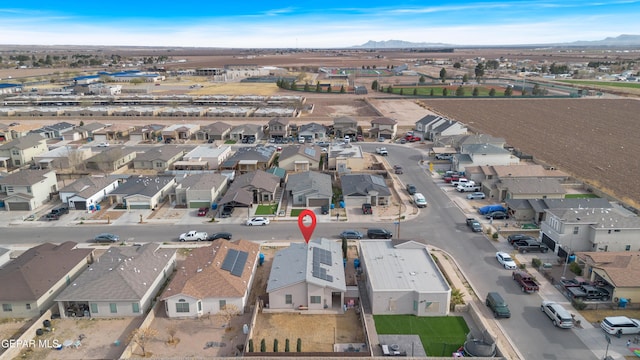 birds eye view of property with a residential view