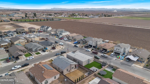 drone / aerial view with a residential view and a mountain view