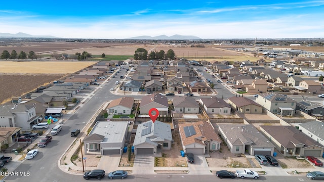 bird's eye view with a residential view and a mountain view