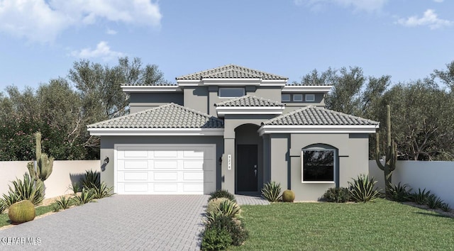 mediterranean / spanish house with a garage, fence, stucco siding, and driveway