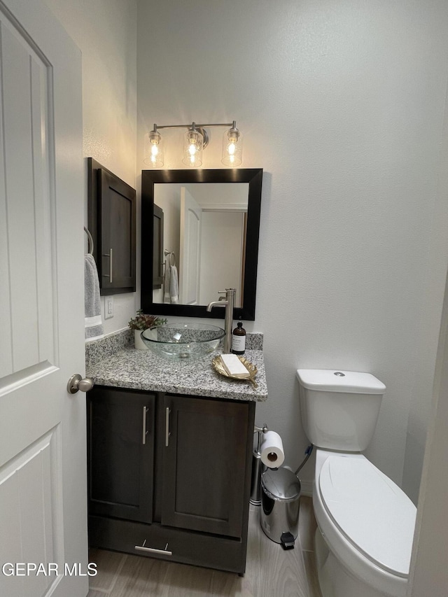 3864 Aspiration St, El Paso, TX 79938 - bathroom featuring vanity, baseboards, and toilet