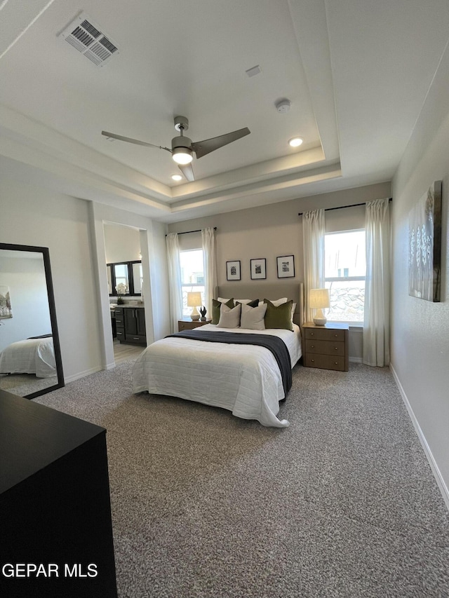 3864 Aspiration St, El Paso, TX 79938 - carpeted bedroom featuring a raised ceiling, baseboards, and visible vents