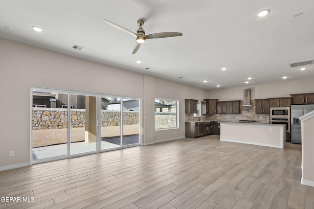 3840 Aspiration, El Paso, TX 79938 - unfurnished living room featuring ceiling fan, light wood-style floors, and recessed lighting