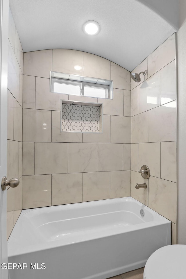 3840 Aspiration, El Paso, TX 79938 - bathroom featuring shower / bath combination and lofted ceiling