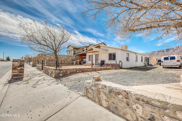 view of front of home with a mountain view