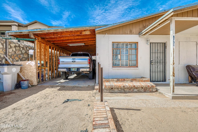 exterior space with a carport