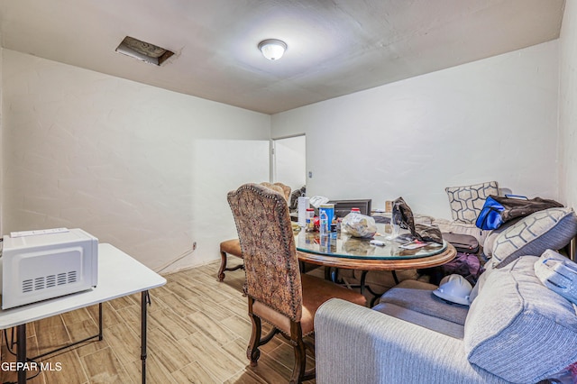 dining room with wood finished floors