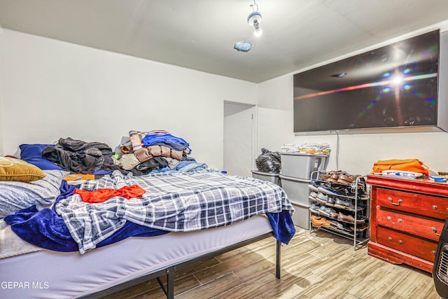 bedroom with wood finished floors