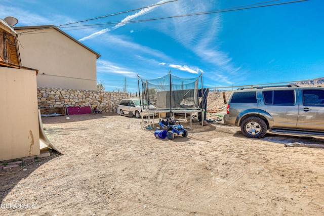 view of yard with a trampoline