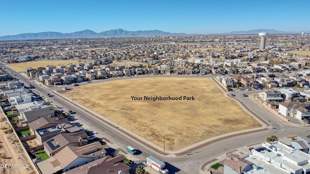 birds eye view of property with a residential view and a mountain view