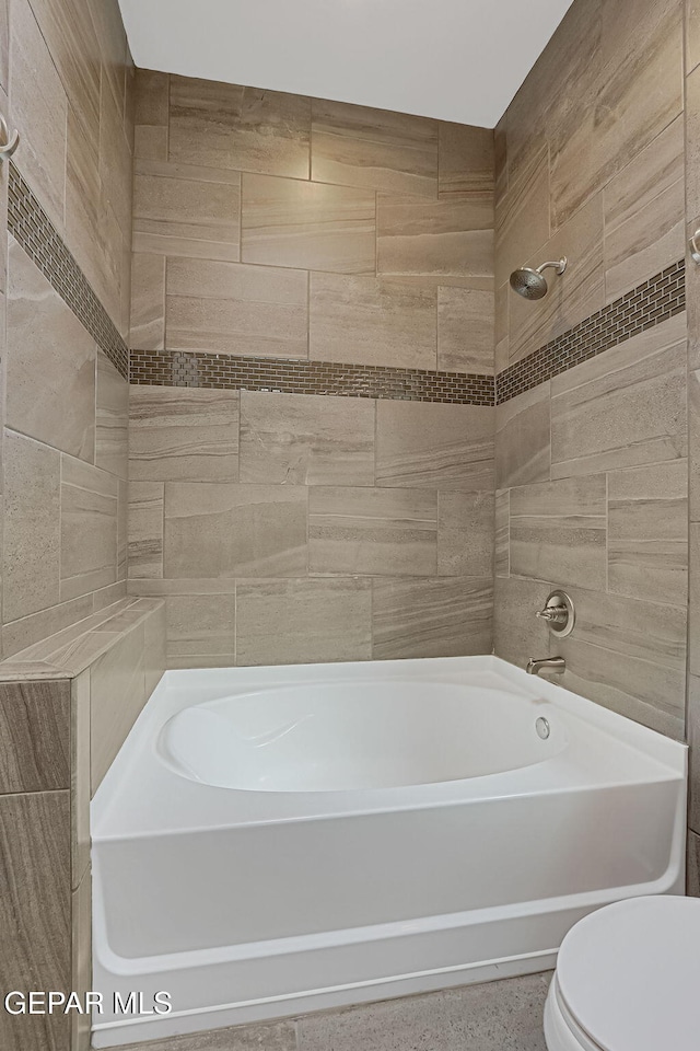 full bathroom featuring toilet and shower / bathing tub combination