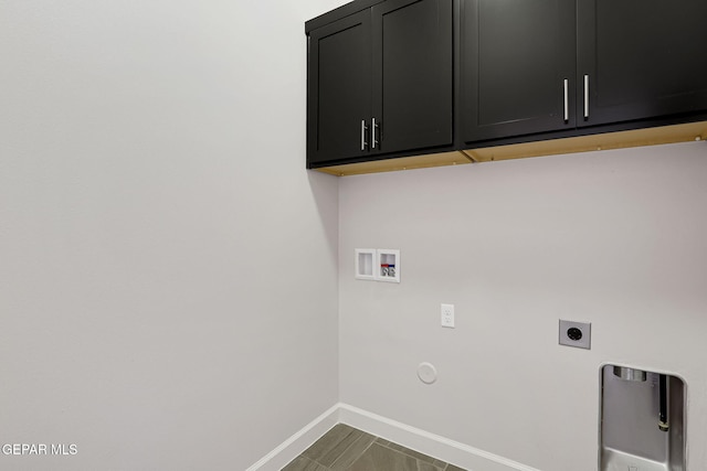 washroom featuring baseboards, hookup for a washing machine, cabinet space, and electric dryer hookup