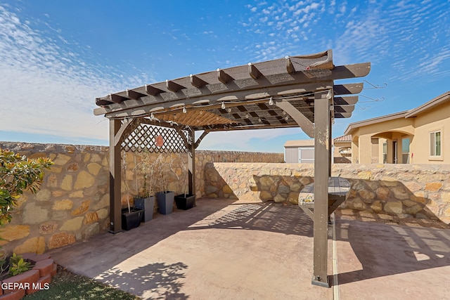 view of patio / terrace featuring fence and a pergola