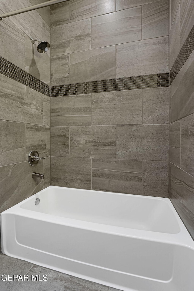 full bath featuring tub / shower combination