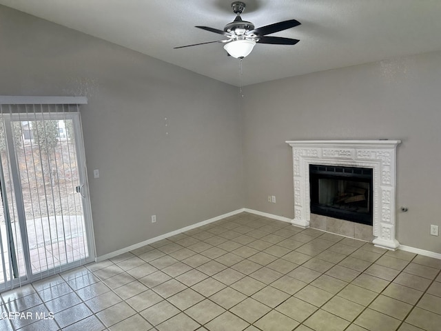 unfurnished living room featuring a ceiling fan, a tile fireplace, light tile patterned flooring, and baseboards