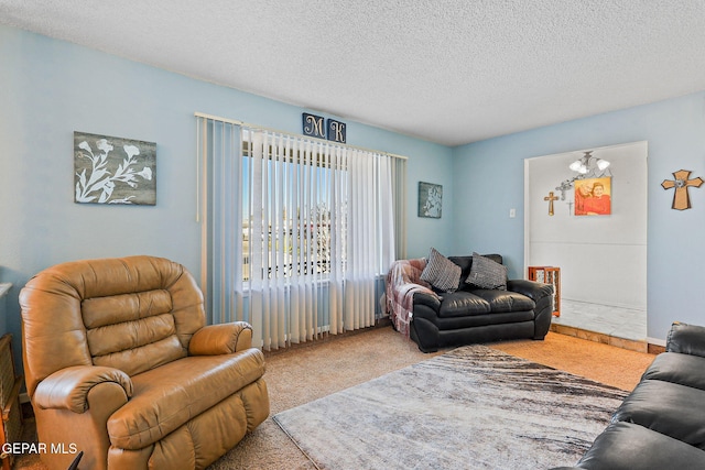 carpeted living room featuring a textured ceiling