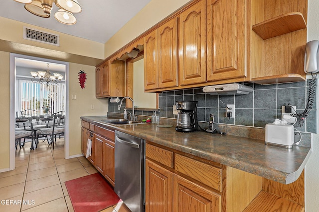 kitchen with a notable chandelier, a sink, visible vents, backsplash, and dishwasher