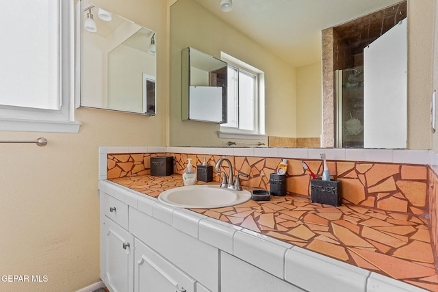 bathroom with backsplash and vanity