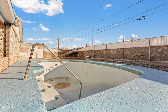 view of pool with a fenced backyard and a fenced in pool