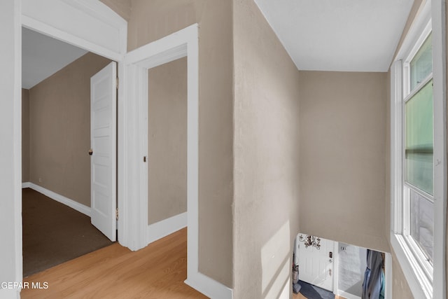 interior space featuring baseboards and wood finished floors