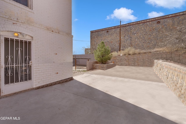 view of patio / terrace featuring fence