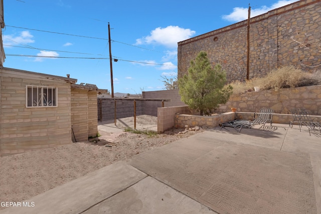 view of yard with a fenced backyard and a patio