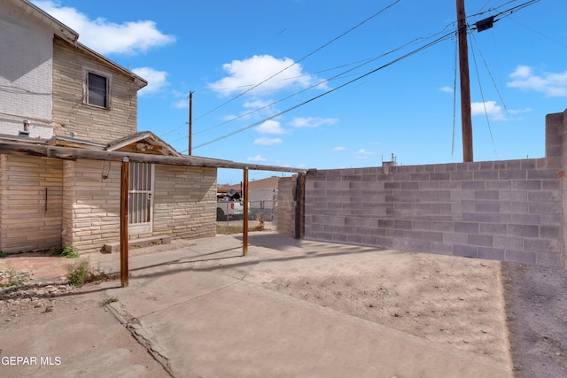 view of patio / terrace with entry steps and fence