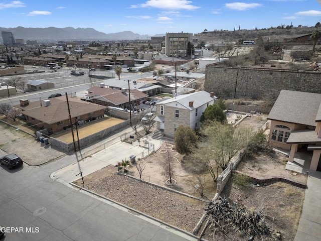 birds eye view of property featuring a mountain view