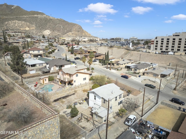 drone / aerial view featuring a residential view and a mountain view