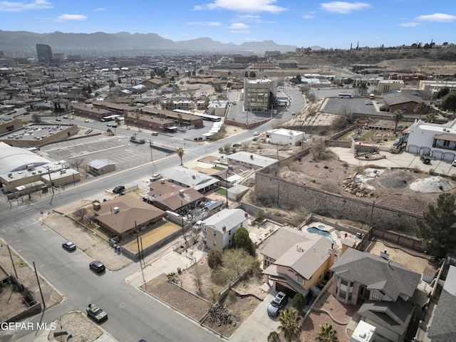 birds eye view of property with a mountain view