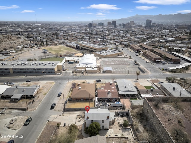 birds eye view of property featuring a mountain view