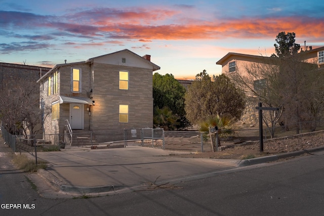 view of front of home featuring a fenced front yard and a gate