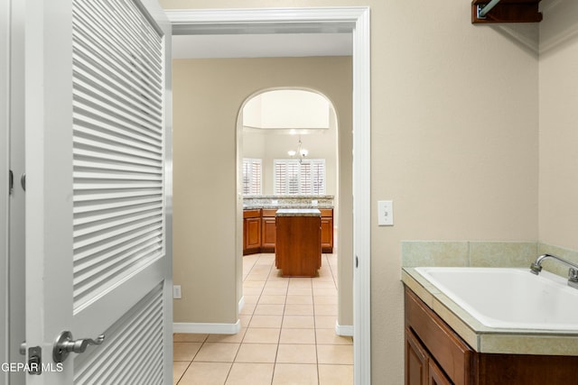 bathroom featuring tile patterned flooring and vanity