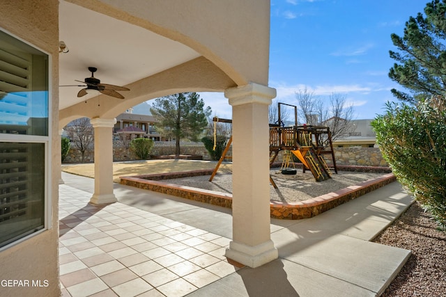 communal playground featuring a patio area