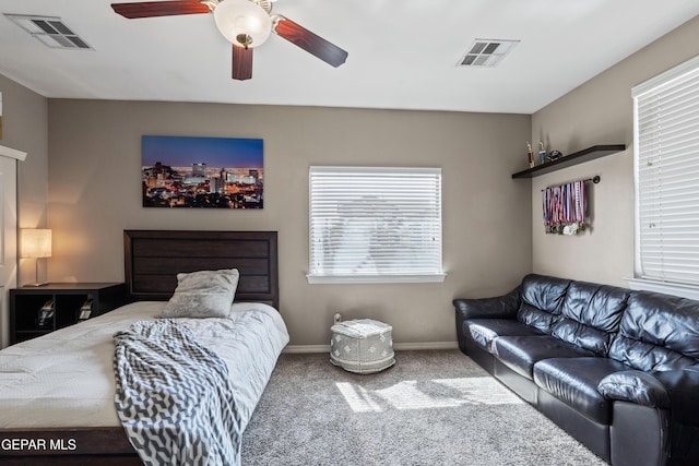 bedroom featuring baseboards, visible vents, ceiling fan, and carpet flooring