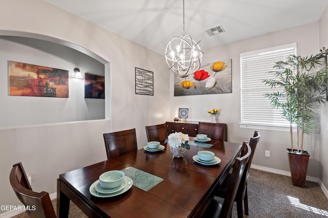 dining room featuring an inviting chandelier, baseboards, visible vents, and carpet flooring