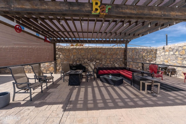 view of patio / terrace with an outdoor living space with a fireplace and a pergola