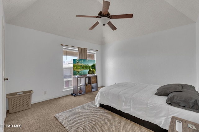 carpeted bedroom with lofted ceiling, ceiling fan, and baseboards