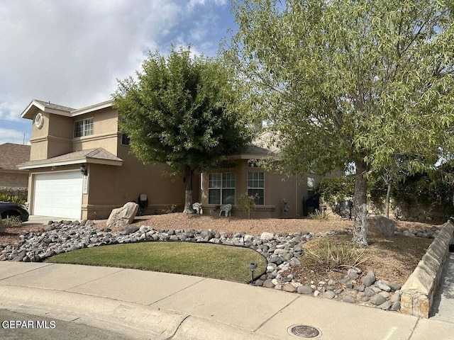 view of property hidden behind natural elements with a garage and stucco siding