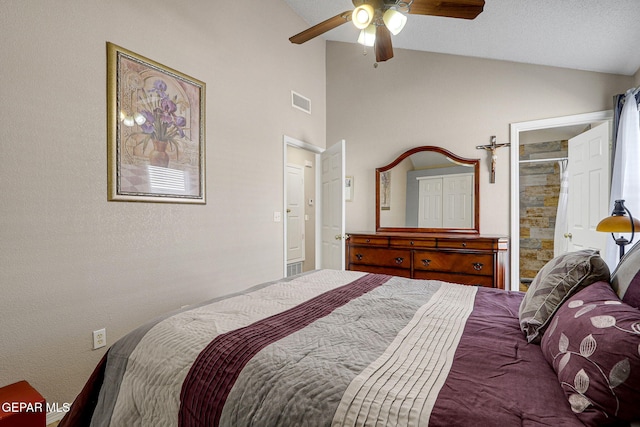 bedroom with connected bathroom, visible vents, vaulted ceiling, and ceiling fan